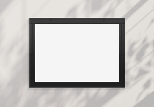 Billboard hanging on a sunlit wall mockup. Template of frame bathed in sunlight 3D rendering