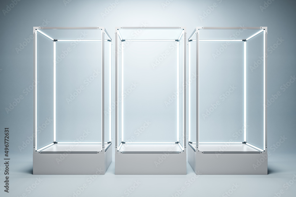 Poster Empty illuminated glass showcase with mock up place on white wall backdrop. 3D Rendering.