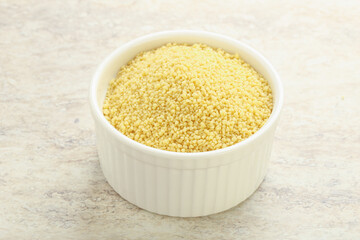 Raw couscous in the bowl
