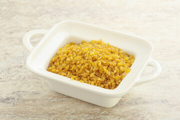 Raw bulgur in the bowl