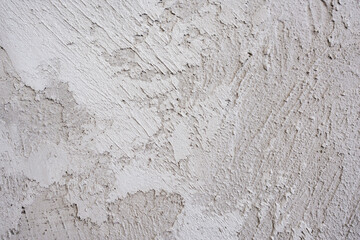 artistic plaster on a gray and white wall. Repairs. elements of wall decor. copy space. texture. background.