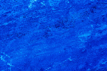 Abstract. Dark blue old concrete wall. The texture has an attractive unique pattern that is perfect for a Design background image.