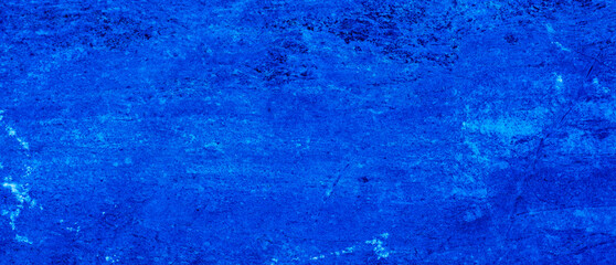 Abstract. Dark blue old concrete wall. The texture has an attractive unique pattern that is perfect for a Design background image.
