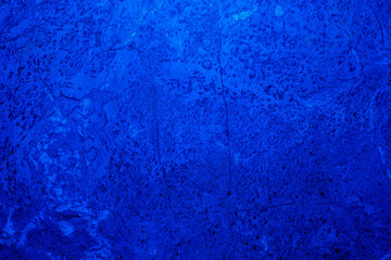Abstract. Dark blue old concrete wall. The texture has an attractive unique pattern that is perfect for a Design background image.