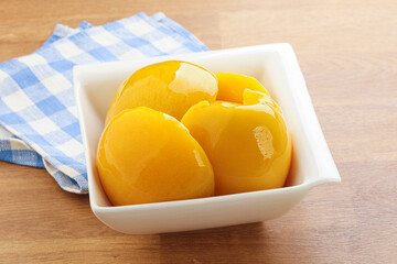 Sweet canned peaches with syrope