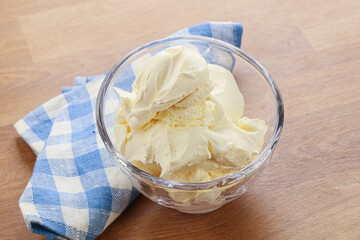 Italian soft mascarpone cheese in the bowl