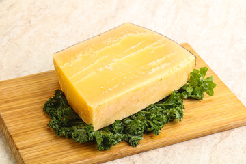 Parmesan cheese piece over board