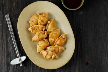 Fried Korean Kimchi Mandu Dumpling  on Oval Plate