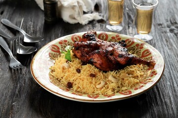 Chicken Kabsa or Chicken Biryani on Wooden Background