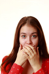 A young girl with a frightened look.