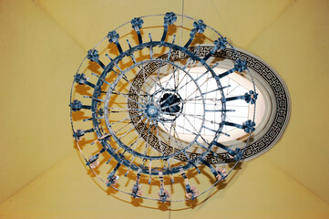 Old wrought-iron chandelier in a dome of the Saint Agata Basilica, Catania, Sicily.