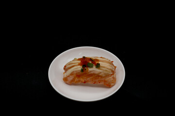 Japanese food, nigiri sushi is a type of sushi that is commonly found in restaurants. Sushi is oval-shaped rice balls and raw fish, squid, etc. are placed on top.Include Clipping Path