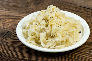 Homemade pickled sauerkraut on a white plate