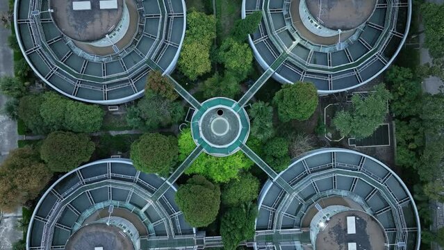 Drone aerial view of waterworks pool and tanks, top view. Environmental conservation, water treatment and industry concept b-roll footage. Water filtration pool in the waterworks, no people view