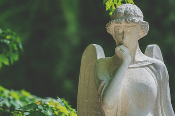 Sad guardian angel. (fragment of an antique statue)