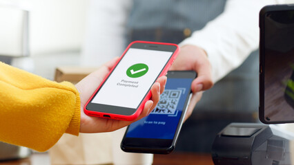 QR code payment, customer using smartphone for paying at shop