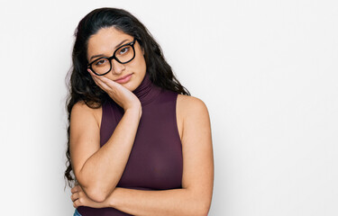 Brunette young woman wearing casual clothes and glasses thinking looking tired and bored with depression problems with crossed arms.