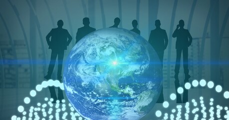 Blue spot of light and white glowing spots over globe against silhouettes of businesspeople