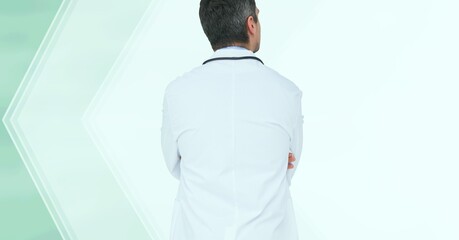 Composition of rear view of male doctor in lab coat and stethoscope with copy space