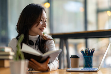 Education study abroad, Asian student girl look at laptop while doing homework making video call abroad using internet friend connection, businesswomen use computer analysis finance data