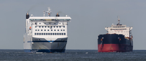 MARITIME TRANSPORT  - Passenger ferry and bulk carrier on waterway to the port 