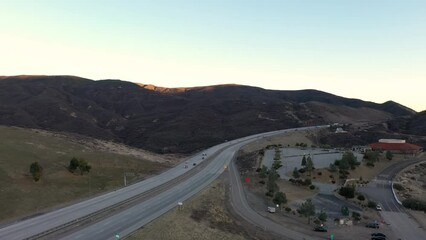 Cars travel on Tejon Pass in Southern California, drone view.