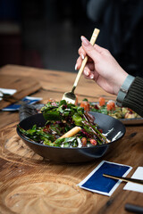 person eating salad