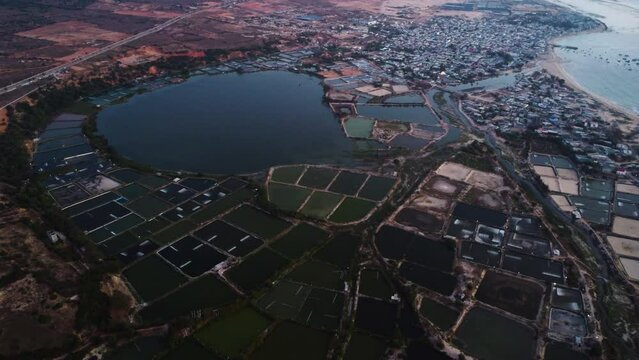 Aerial view of Son Hai urban district city town of vietnam, Shrimp pond agricultural farming fisherman village with coastline polluted seascape 