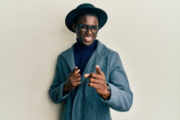 Young african american man wearing elegant style pointing fingers to camera with happy and funny...