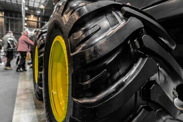 Close up photo of some tractor wheels. Brand new tractor and loader tires.