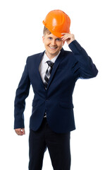 Portrait of a man in a business suit and hard hat. The builder smiles at us, a handsome, friendly team leader, the engineer took his hand at a helmet. happy successful businessman. white background