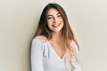 Obraz premium Young caucasian woman wearing casual white t shirt with a happy and cool smile on face. lucky person.