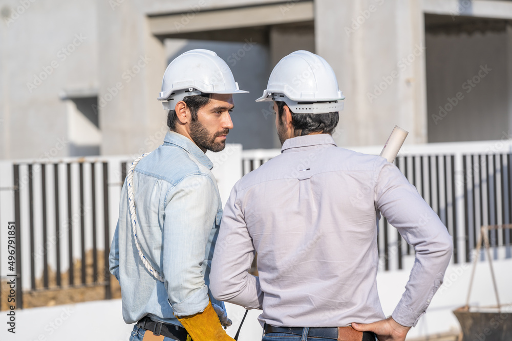 Poster Team engineer and architects are meeting to plan for new project measuring layout of building blueprints in construction site,Construction residential new house in progress at building site.