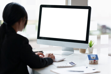 Businesswoman or Accountant working on desktop computer at office.