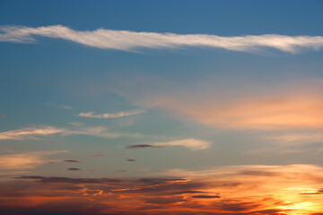 Fototapeta na wymiar Beautiful sunrise, light majestic clouds in the sky.