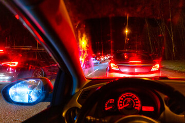 Car windscreen with big traffic lights at night