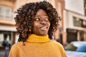 African american woman smiling confident at street
