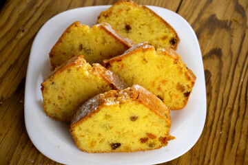 image of a delicious cupcake with raisins and candied fruit on a board close-up