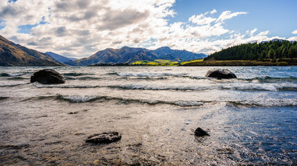 Mesmerizing seascape view with mountains in the background in Wanaka, New Zealand