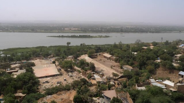 Aerial tilt up shot of River Niger seen from neighborhood of Niamey, Niger
