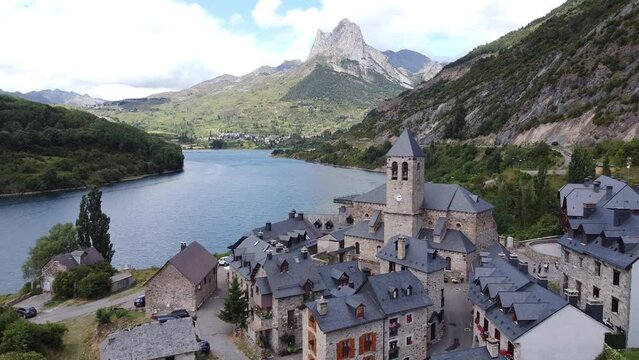 Lanuza at Tena Valley, Huesca, Aragon, Spanish Pyrenees, Spain - Aerial Drone View of the Mountain Village and Dam Lake Embalse de Bubal