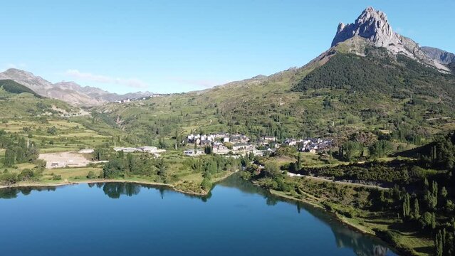 Sallent de Gallego at Tena Valley, Huesca, Aragon, Spanish Pyrenees, Spain - Aerial Drone View of the Mountain Village and Dam Lake Embalse de Bubal