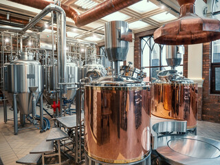 Brewery equipment. Brew manufacturing. Round steel storage tanks for beer fermentation and...