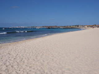Sandy beach with pier on Atlantic Ocean at Sal island, Cape Verde