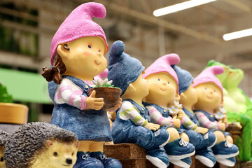 Garden gnomes and animals in the store. Toys for infield decoration