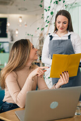 woman ordering food or drink in restaurant