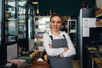 woman waitress standing crossed arms and looking at camera