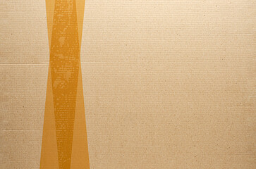 Brown tape on cardboard. The concept of transporting things, sending a donation or packing parcels....