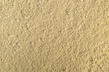 Close up of organic green natural clay powder for face mask, face cream, body wrap, selective focus. Abstract background