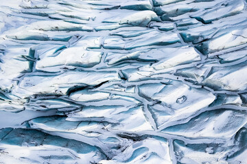 Aerial view of the abstract background from a glacier ice in wintertime, Iceland.